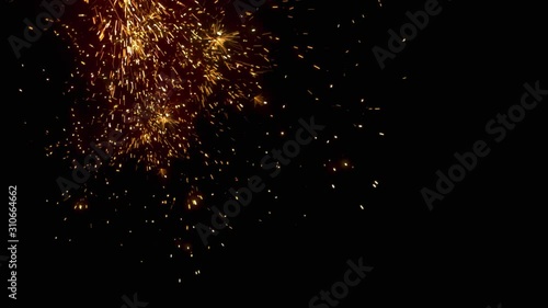 Welding sparks falling on black background