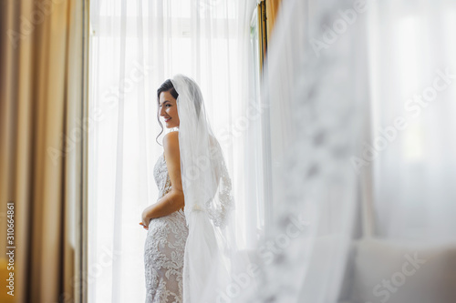 getting ready - beautiful bride at the window