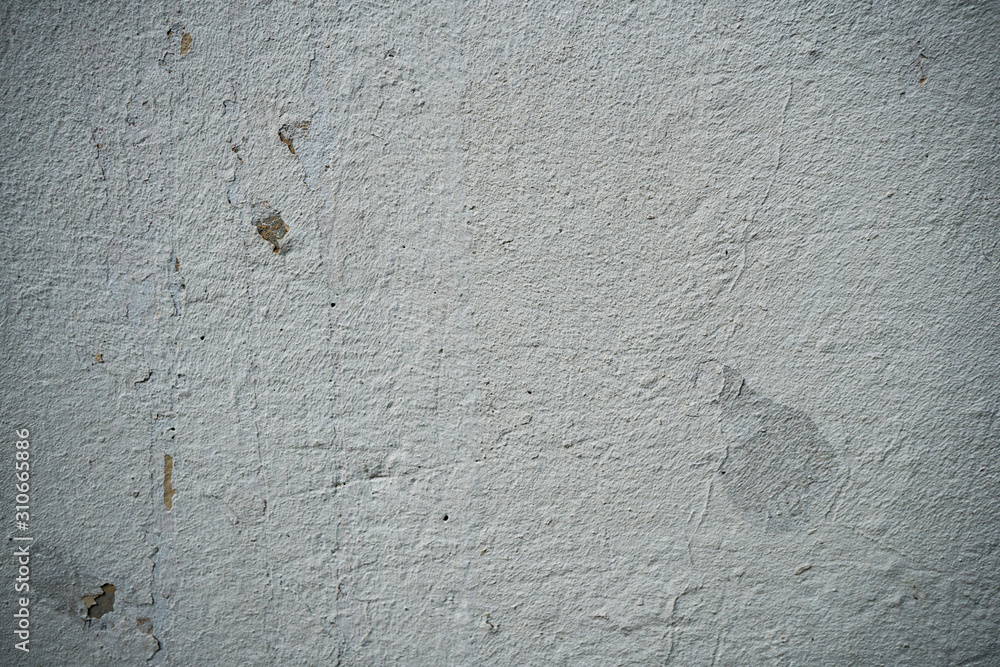 Fototapeta premium Texture of an old wall covered with paint. Background image of a worn paint coated surface