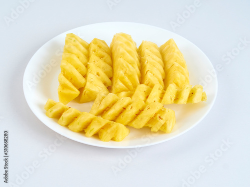 Pineapple slices in white plate