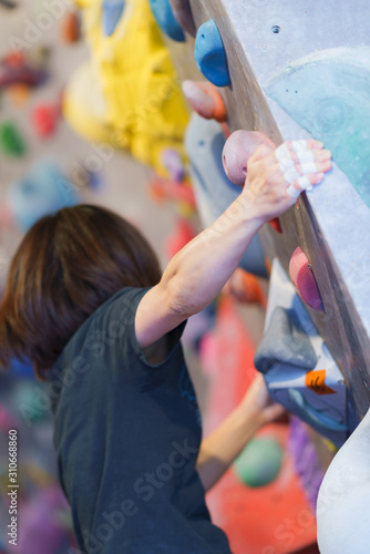 Lady and landscape of Bouldering climbing studio in Japan