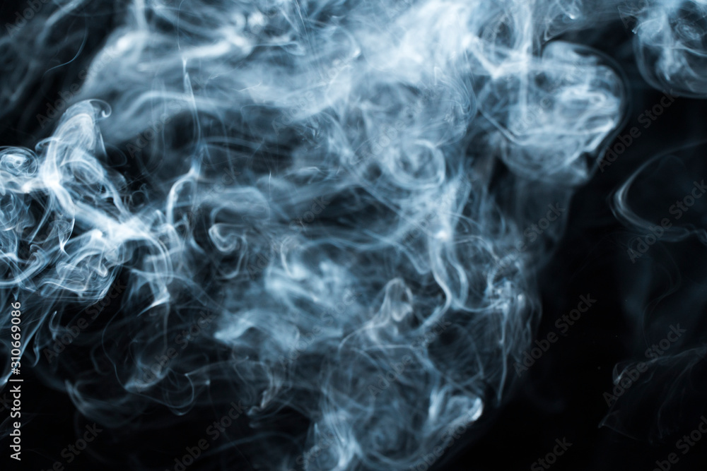 Obraz premium Photo of a wisp of smoke on a dark background