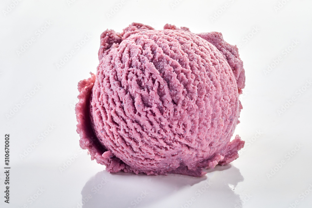 Purple scoop of berry ice cream in close-up Purple scoop of berry ice cream in close-up