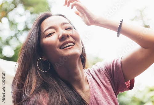 portrait happy cheerful young brunette asian woman with perfect smilling,clean skin.beautiful girl posing show white teeth smile relaxing.fashion people freedom life style concept