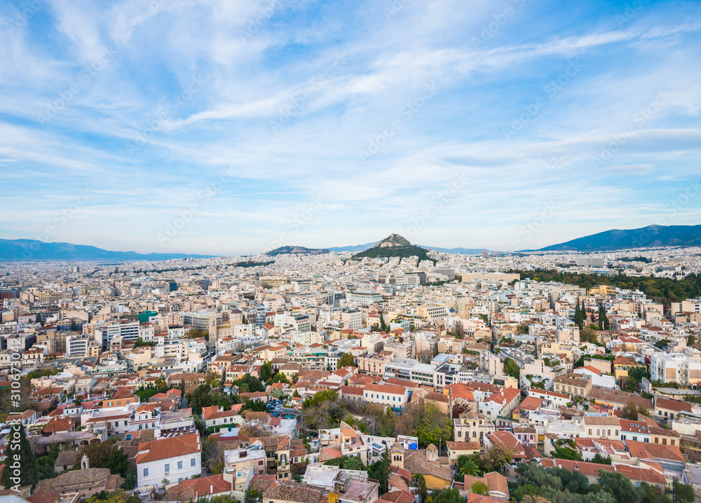 Aerial view of Athens, Greece with houses, blue sky and Lycabettus hill