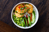 Take Away Healthy Buddha Bowl with Shrimp, Edamame Beans, Cucumber and Basmati Rice / Poke Bowl in Plastic Box Package or Container.