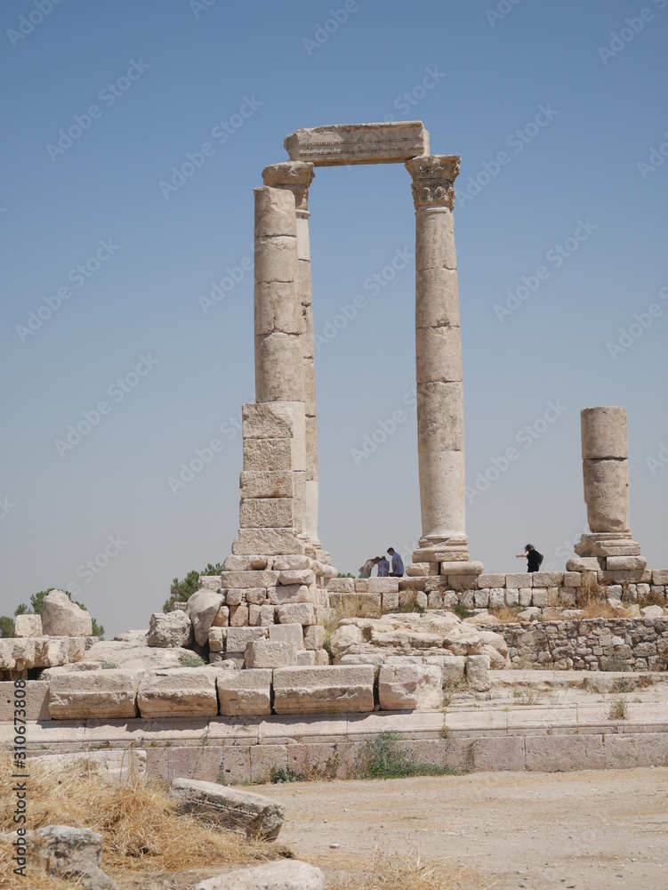 Tall majestic pillars of the ruins of the Roman site of Amman Citadel on a hill in the city center of the capitol of Jordan