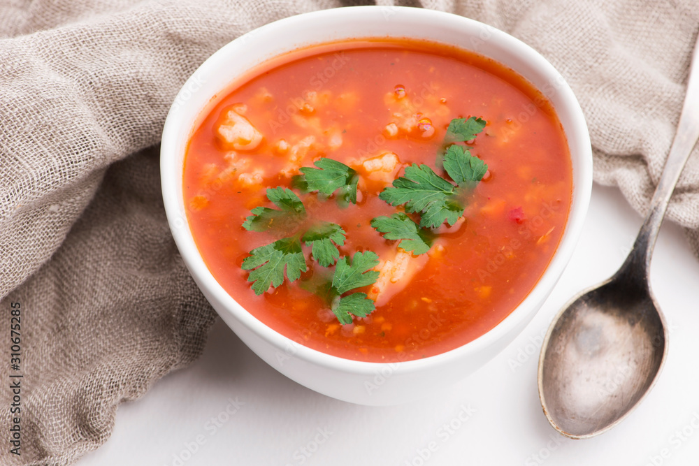 Tomato soup with rice decorated with parsley Tomato soup with rice decorated with parsley