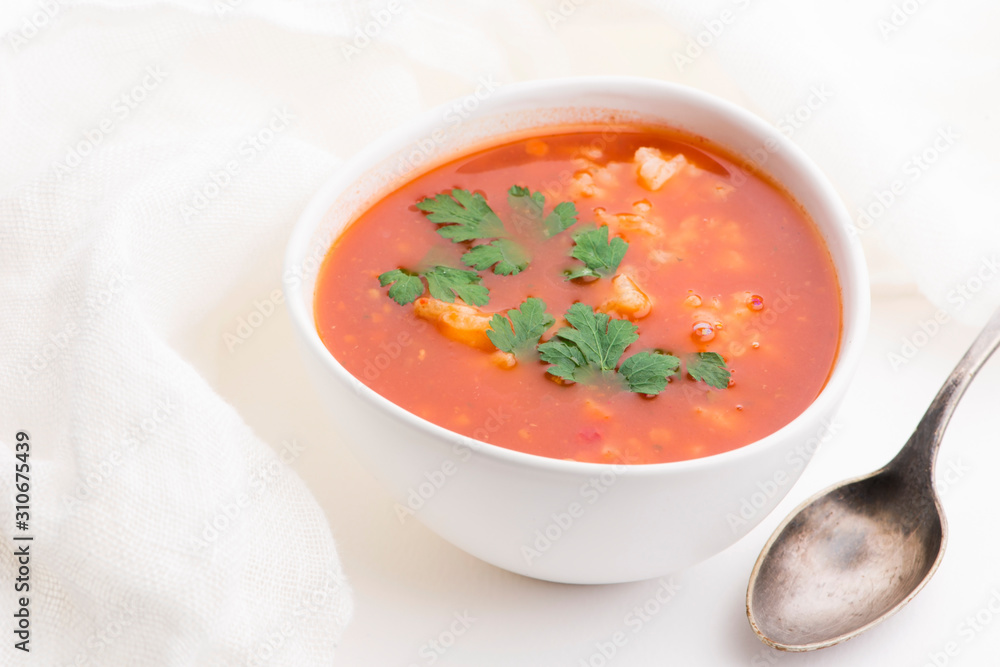Tomato soup with rice decorated with parsley Tomato soup with rice decorated with parsley