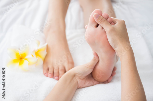 Woman having spa massage on her feet at beauty salon