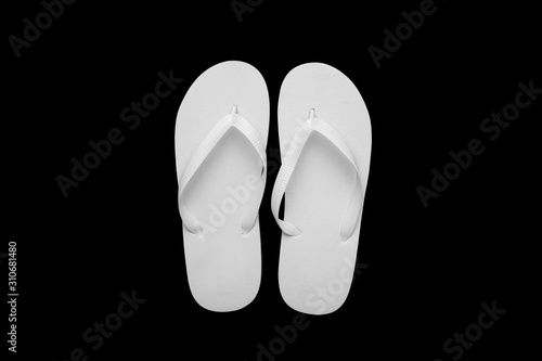 Blank white flip flops on a black cutted background. Mock-up.