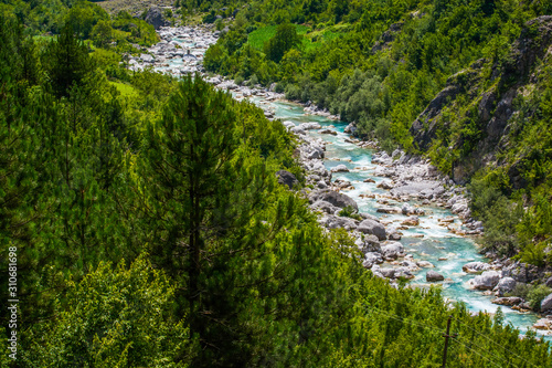 Turquoise blue water in river in albanian mountains Theth near Breg Lumi, Albania