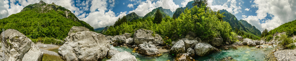 Crystal clear river Lumi i Thethit in National Park Theth in Albania