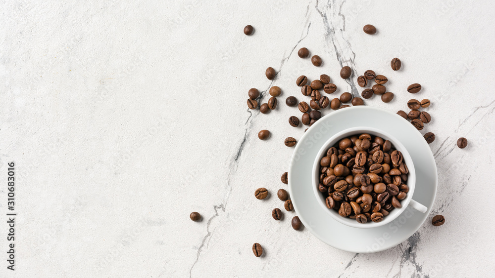 Roasted coffee beans in white cup Roasted coffee beans in white cup