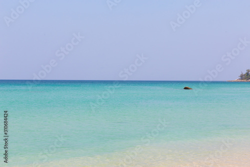 Beach scene  calm summer nature landscape. Blue sky and ocean waves