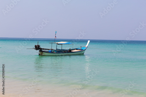 Long tail boat moored on the beach
