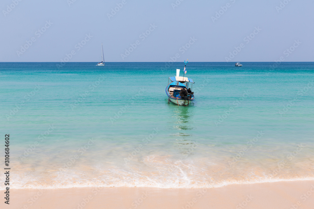 Long tail boat moored on the beach