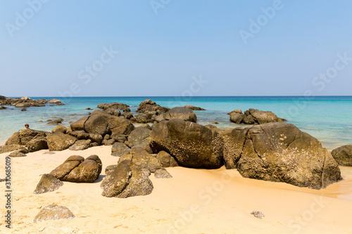Sandy beach with boulders