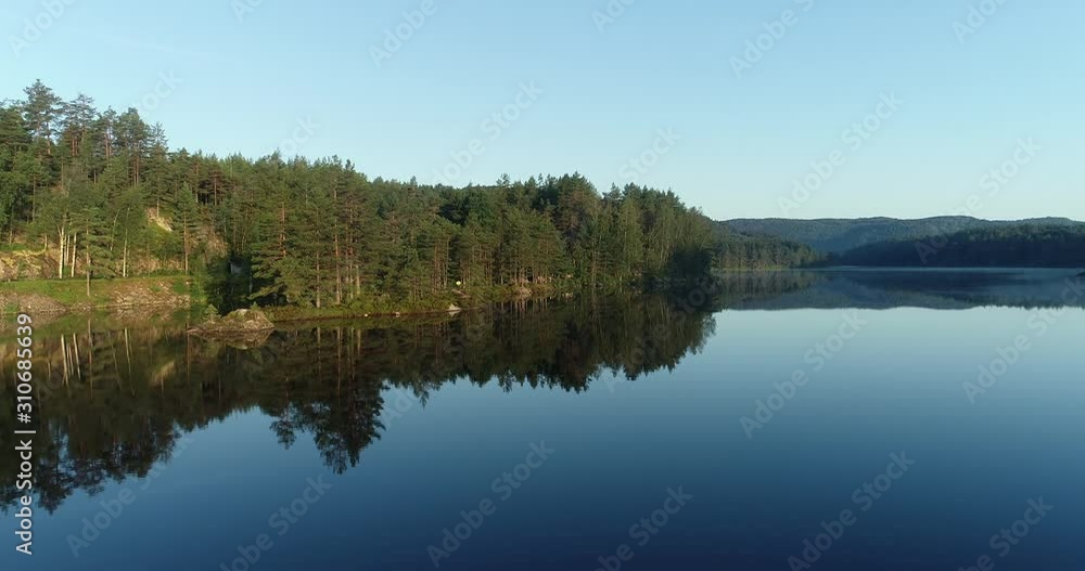 Dawn over norwegian river and forest in Gåseflå showed by drone. Dawn over norwegian river and forest in Gåseflå showed by drone.