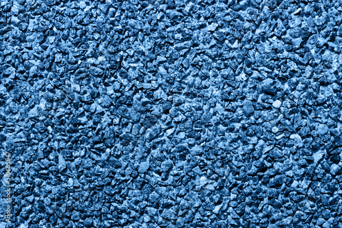 Handmade gravel stones background blue colored.