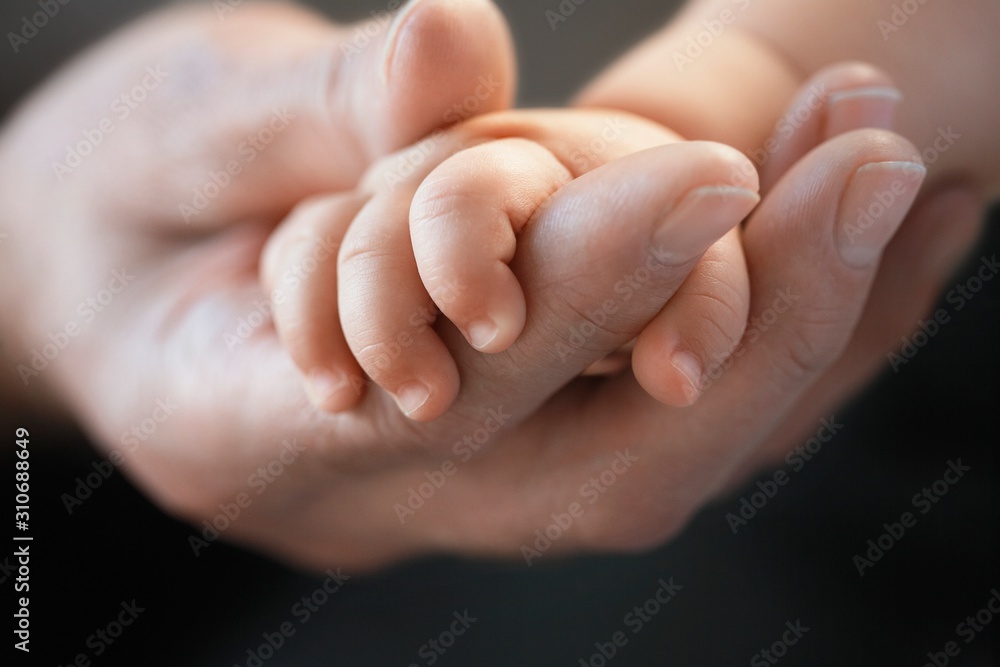 Closeup Of Baby Holding Man's Finger Closeup Of Baby Holding Man's Finger