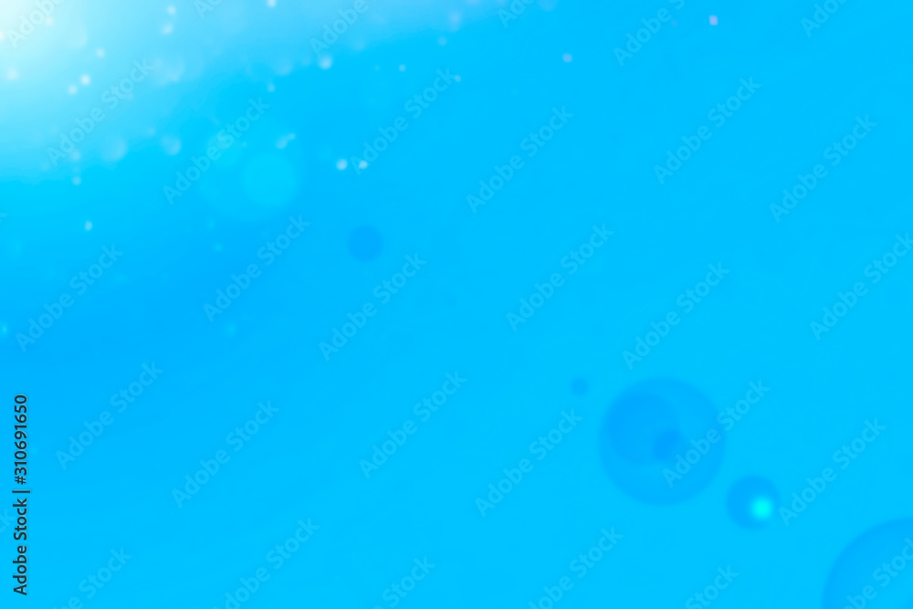Blue abstract christmas bokeh light on the background Blue abstract christmas bokeh light on the background