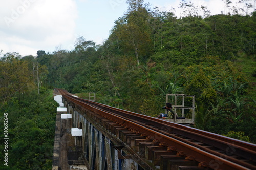 Railroad is a means of transportation for trains that are built on bridges using iron and a solid concrete frame