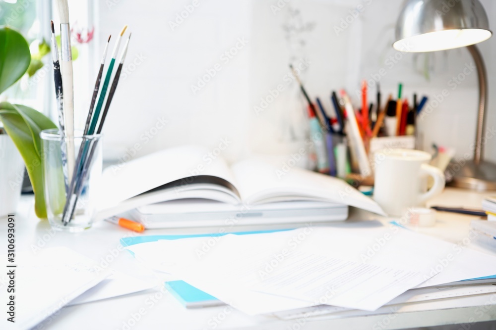 Desk With Books; Papers And Brushes Desk With Books; Papers And Brushes