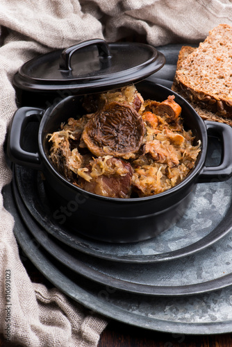 Traditional polish sauerkraut (bigos) with mushrooms and plums for christmas photo