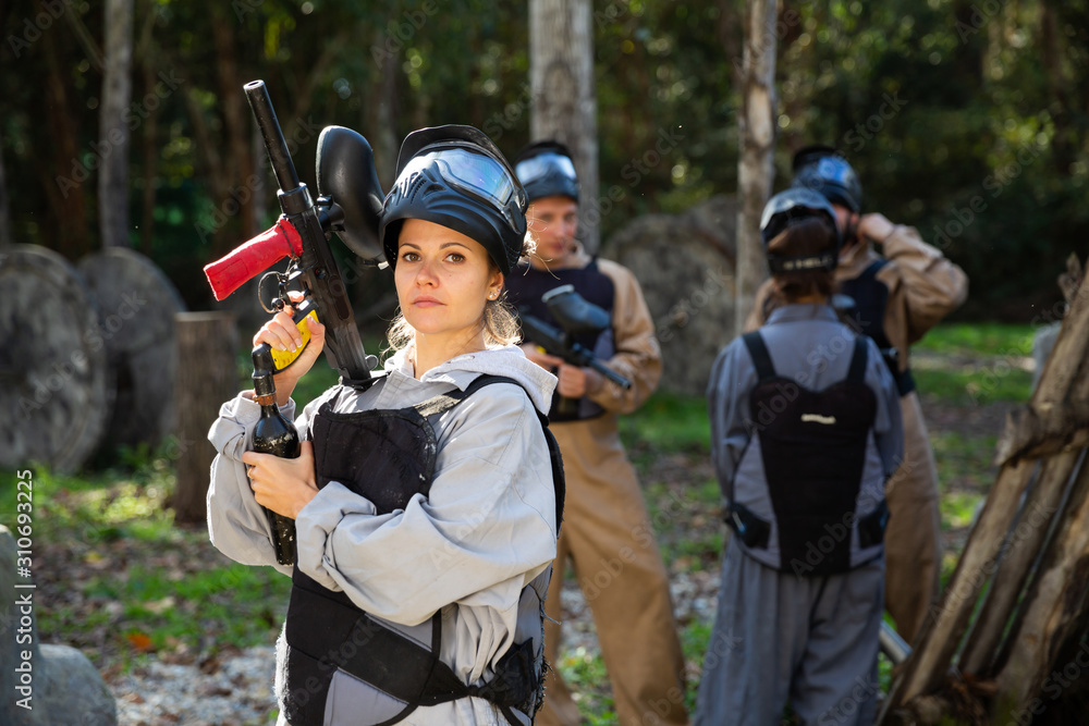 Fototapeta premium Portrait of young woman paintball player