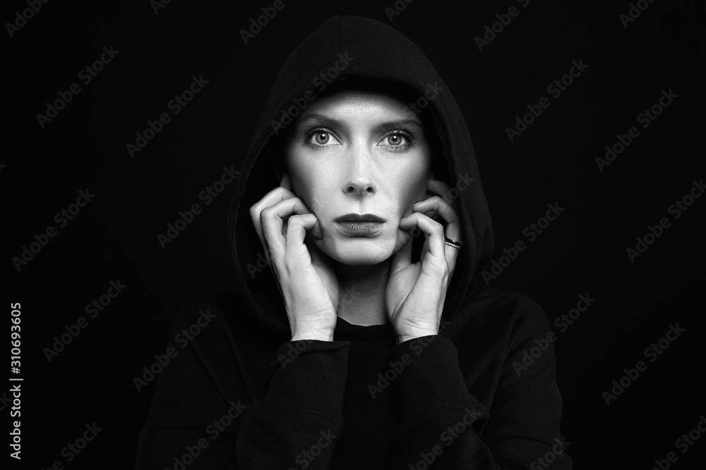 beautiful woman in hood. Monochrome portrait of woman beautiful woman in hood. Monochrome portrait of woman