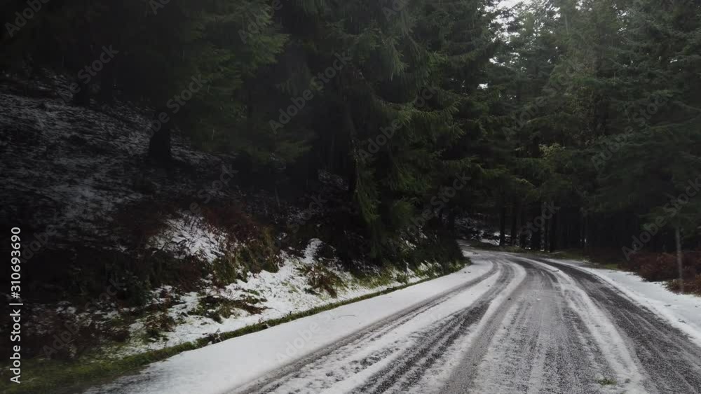 Point of view of a car driver progressing through a winter road in Poiso, Madeira island, Portugal Point of view of a car driver progressing through a winter road in Poiso, Madeira island, Portugal