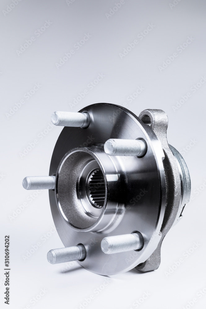 New Wheel hub assembly with bearing. This is part of the car suspension on a gray background with a gradient. The concept of new car parts New Wheel hub assembly with bearing. This is part of the car suspension on a gray background with a gradient. The concept of new car parts