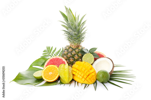 Fototapeta Naklejka Na Ścianę i Meble -  Fresh exotic fruits and palm leaves isolated on white background