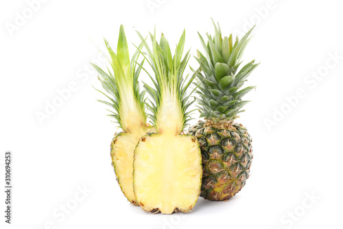 Pineapple and two halves isolated on white background. Juicy fruit