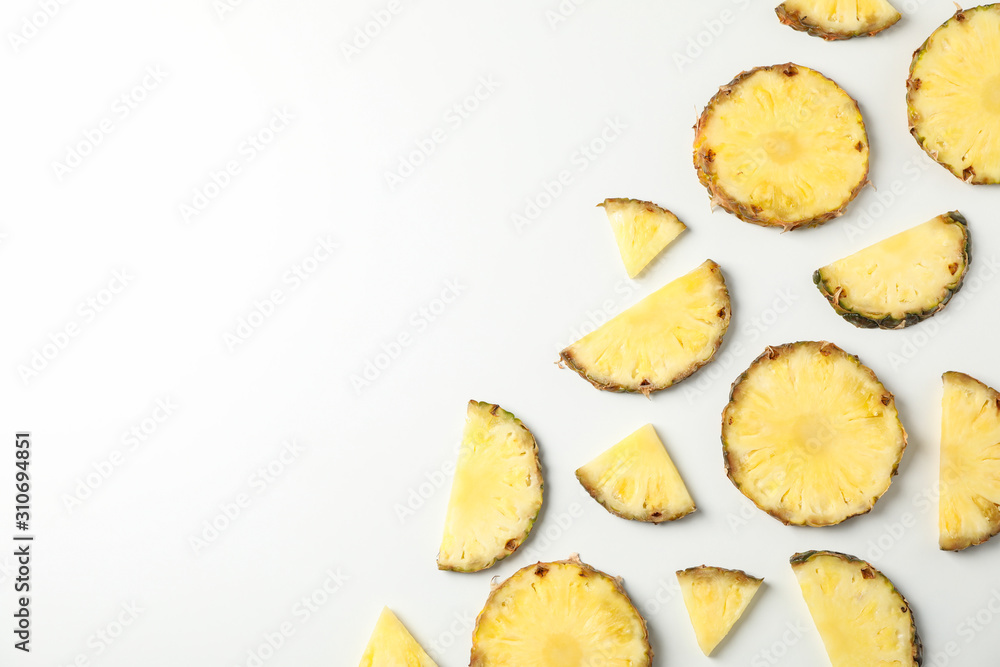Flat lay with pineapple slices on white background, space for text Flat lay with pineapple slices on white background, space for text