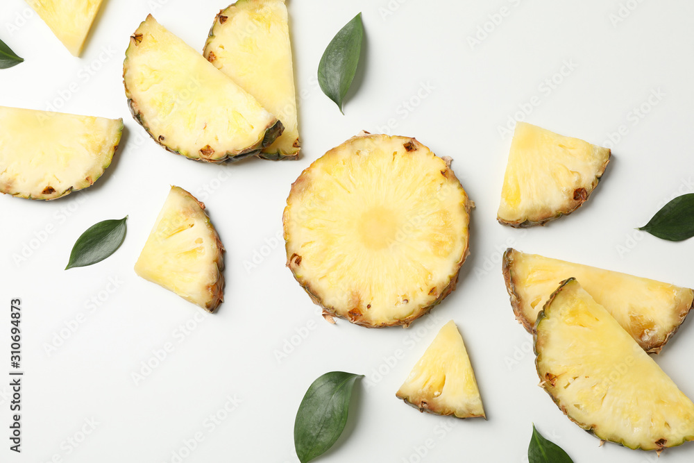 Flat lay with pineapple slices on white background, space for text Flat lay with pineapple slices on white background, space for text