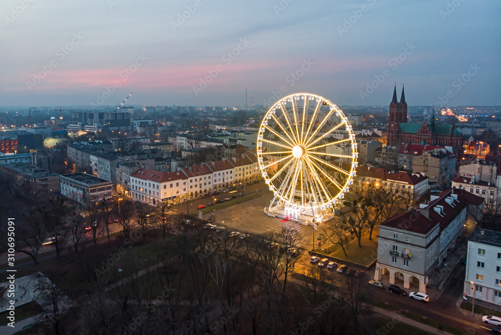 Ferris wheel at the Old Market in the city of Lodz, Poland. - obrazy, fototapety, plakaty 