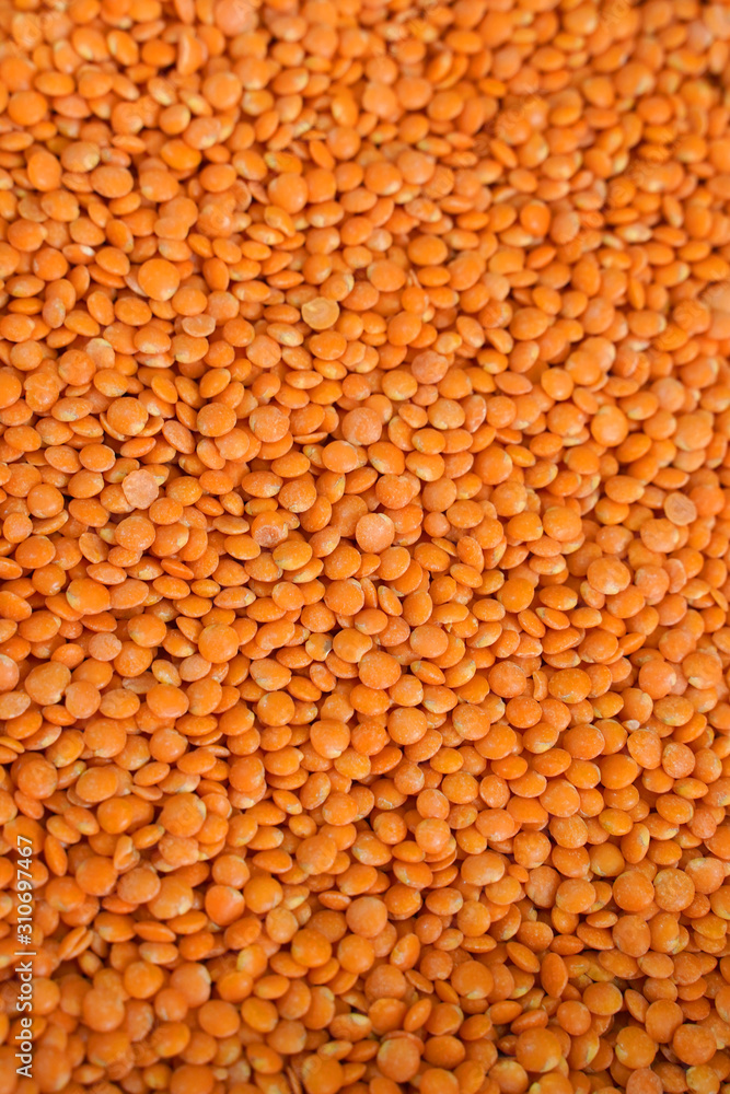 red lentils background, close up red lentils background, close up