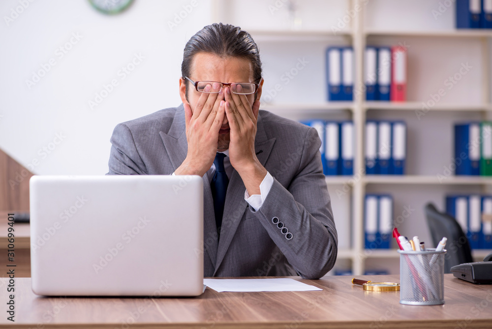 Unhappy male businessman in the office