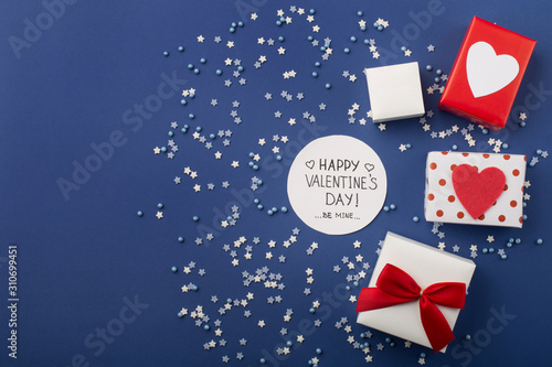 Happy Valentine's Day card with small stars, gifts and red hearts