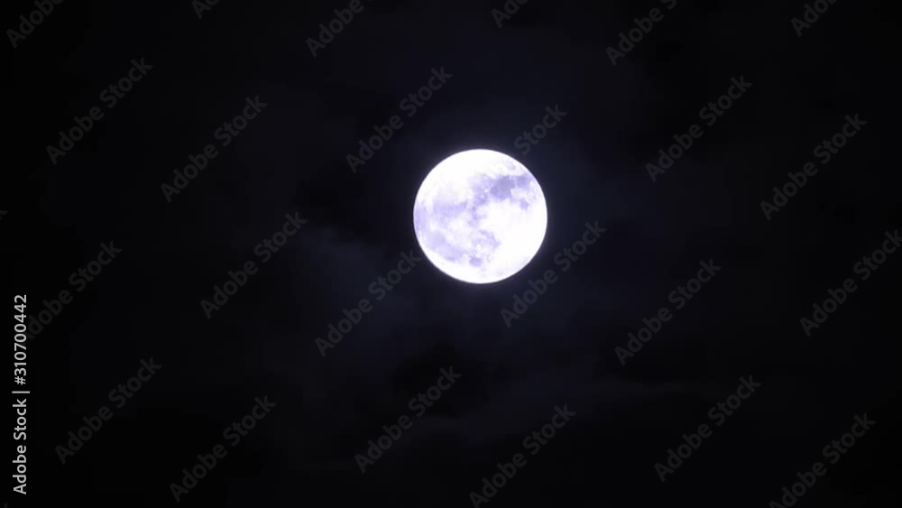 Full moon in the night sky with running clouds Full moon in the night sky with running clouds
