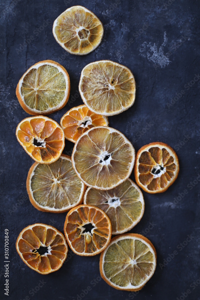 top view flat lay arrangement of dry oranges and mandarin. food pattern on dark background. Christmas composition top view flat lay arrangement of dry oranges and mandarin. food pattern on dark background. Christmas composition