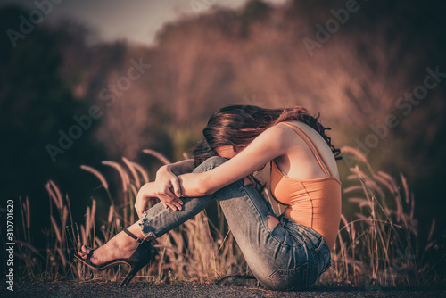 Beautiful thai woman very sad from unrequited love,rethink,think over,vintage style,dark tone,broken heart,asian girl photo