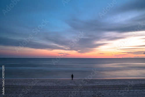 silhouette of man on beach