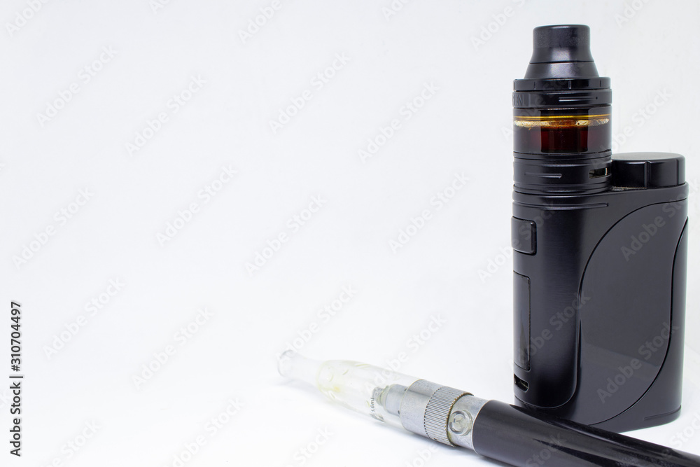 Two varieties of electronic cigarettes, close-up, isolated on a white background. Two varieties of electronic cigarettes, close-up, isolated on a white background.