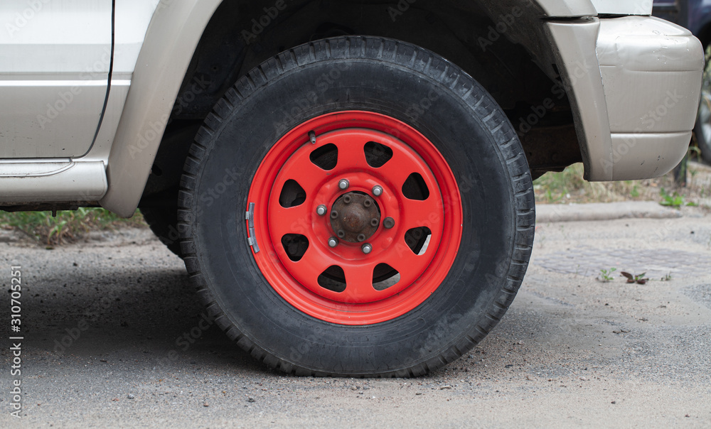 Closeup photo of red car wheel