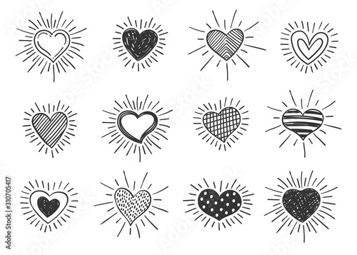 Set of doodle decorated heart shaped symbols with retro styled sun rays. Collection of different hand drawn romantic hearts for sticker, label, love logo and Valentines day design.