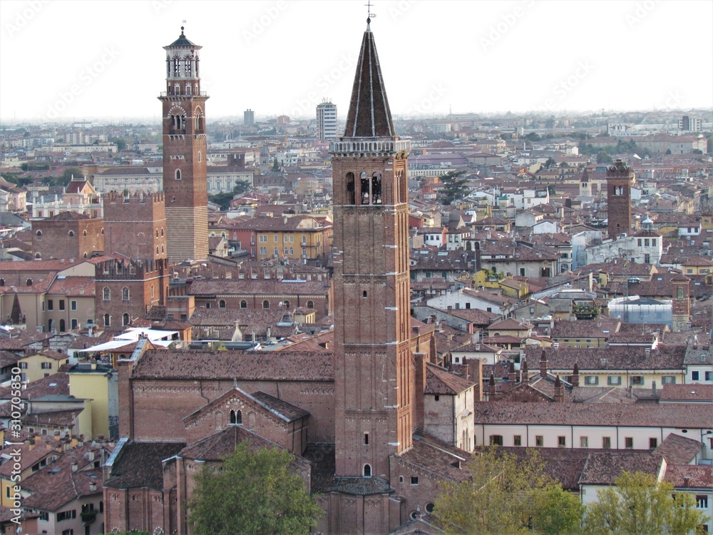 View of Verona Streets and Architecture. The Beautiful city of Romeo and Julietta shows its beauty full of details and history. Towers (Torre di Lamberti), Bridges (Ponte di Castelvecchio).