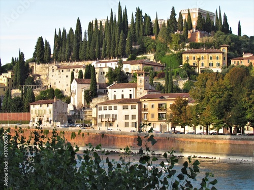 View of Verona Streets and Architecture. The Beautiful city of Romeo and Julietta shows its beauty full of details and history. Towers (Torre di Lamberti), Bridges (Ponte di Castelvecchio). photo